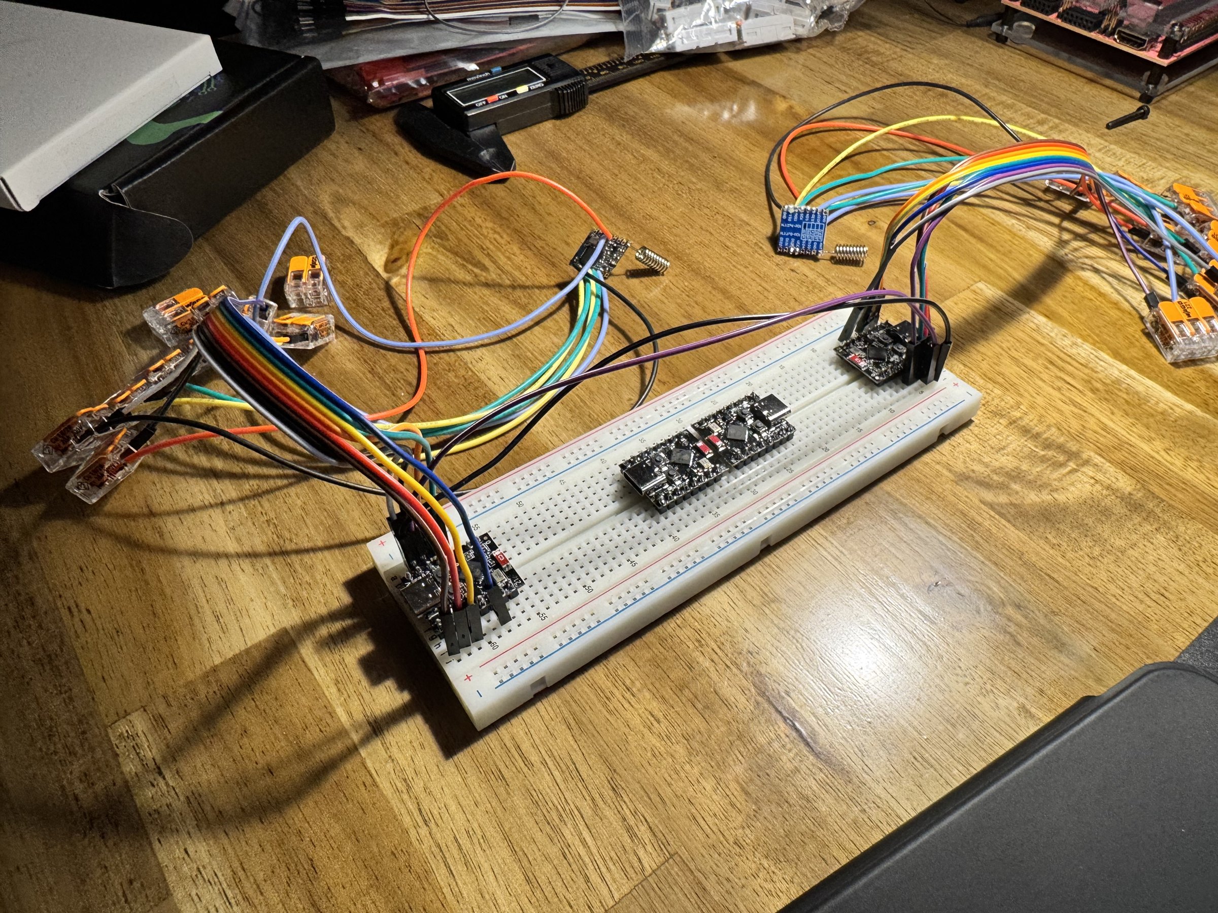 Two ESP32-C3 boards on one breadboard, each wired to an SX1276 LoRa radio module