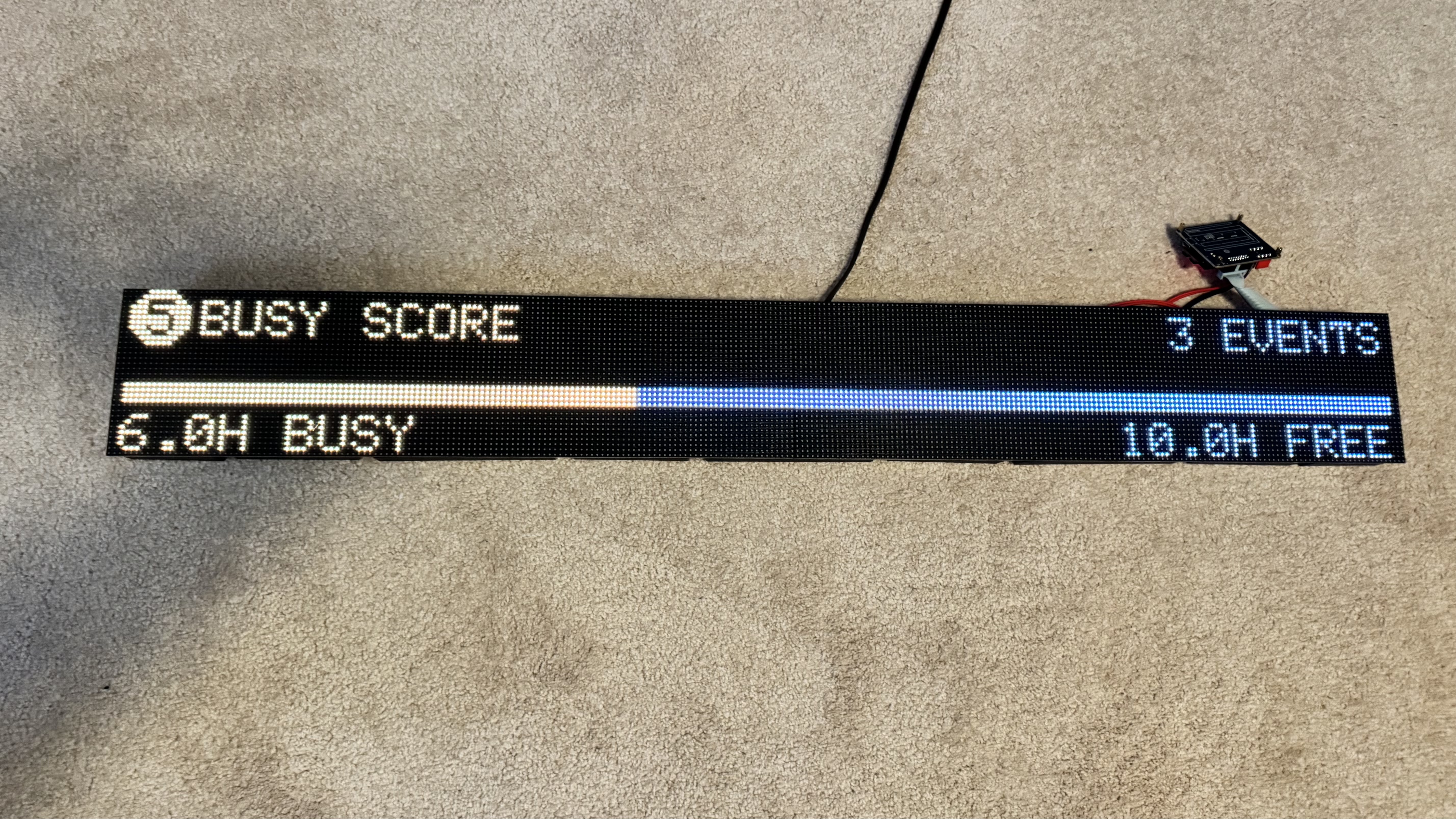 The finished LED wall running, showing the busy score screen